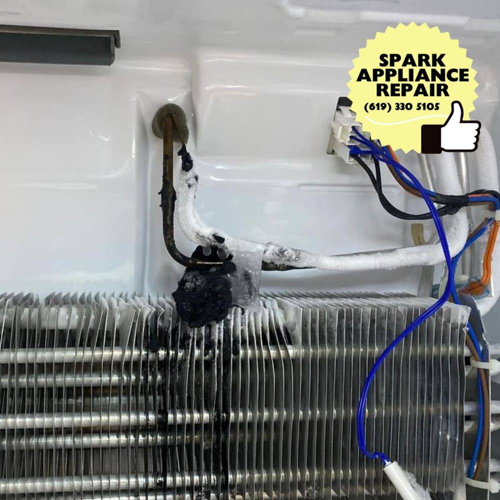 Frosted evaporator coil and failed defrost heater inside a freezer during a San Diego service call &mdash; defrost-system repair by Spark Appliance Repair