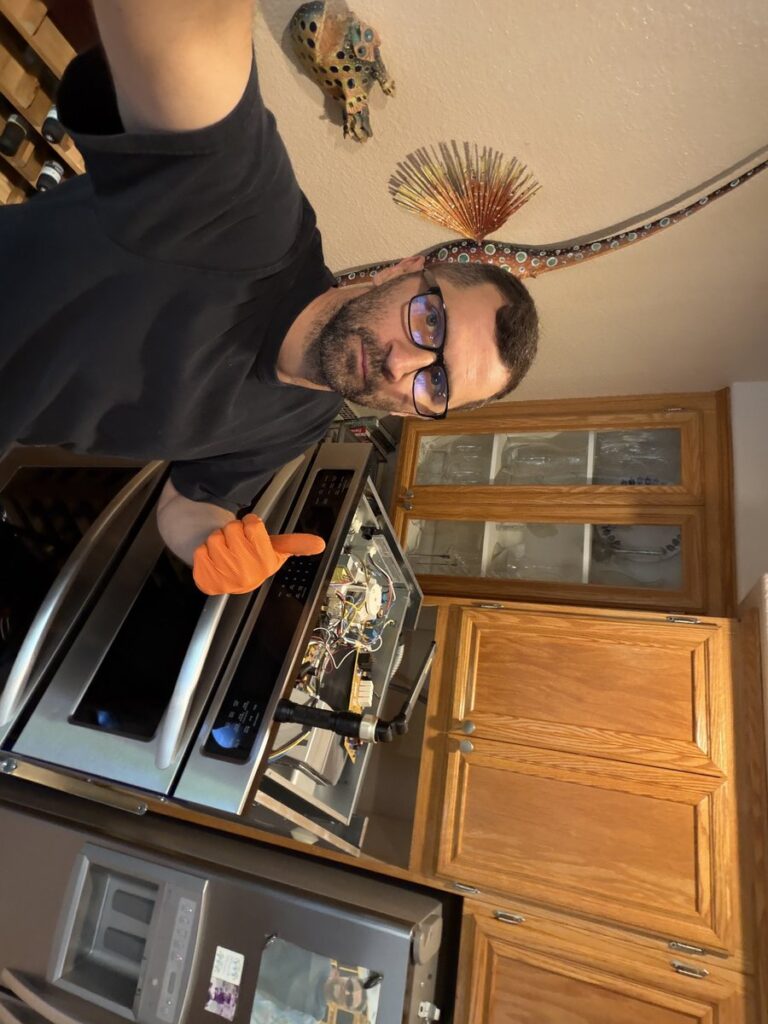 Spark Appliance Repair technician diagnosing oven issues in San Diego