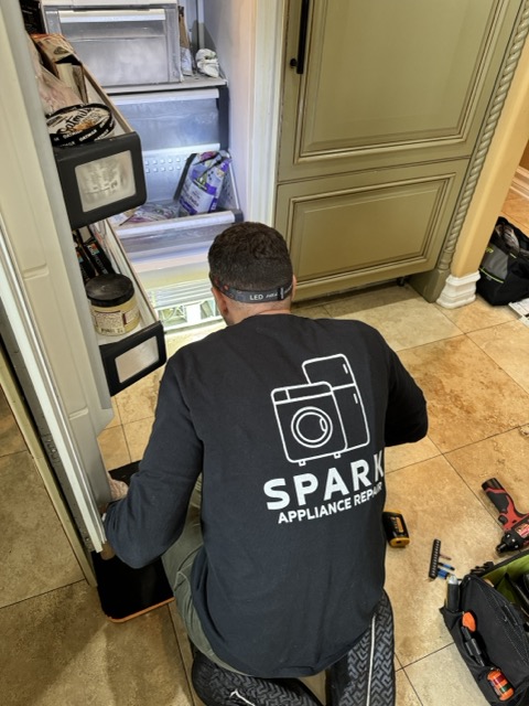 Spark technician repairing Viking appliance in San Diego