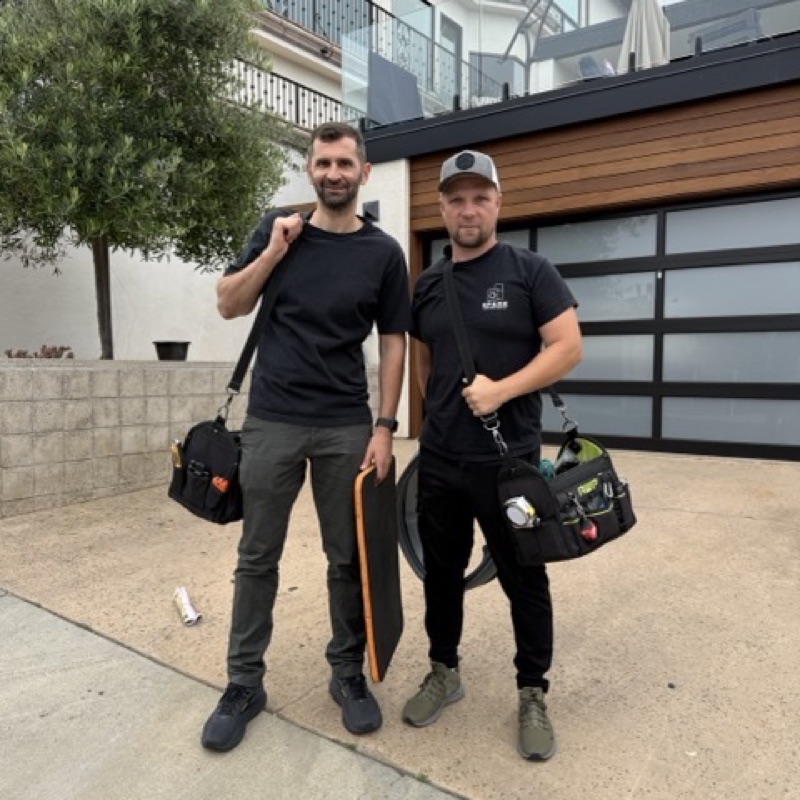 Two Spark Appliance Repair technicians ready for a commercial service call in San Diego
