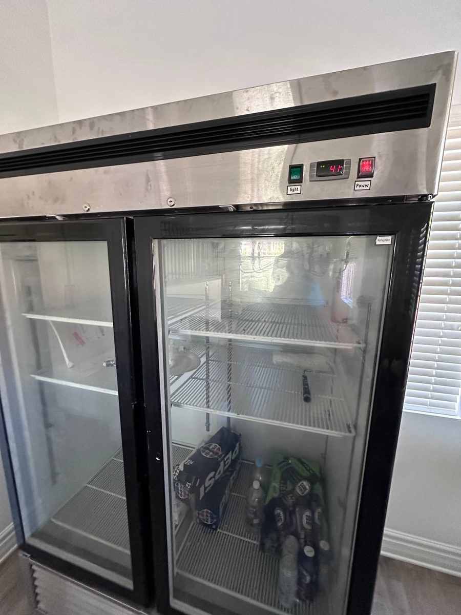 Commercial glass-door merchandiser refrigerator repaired by Spark Appliance Repair in San Diego