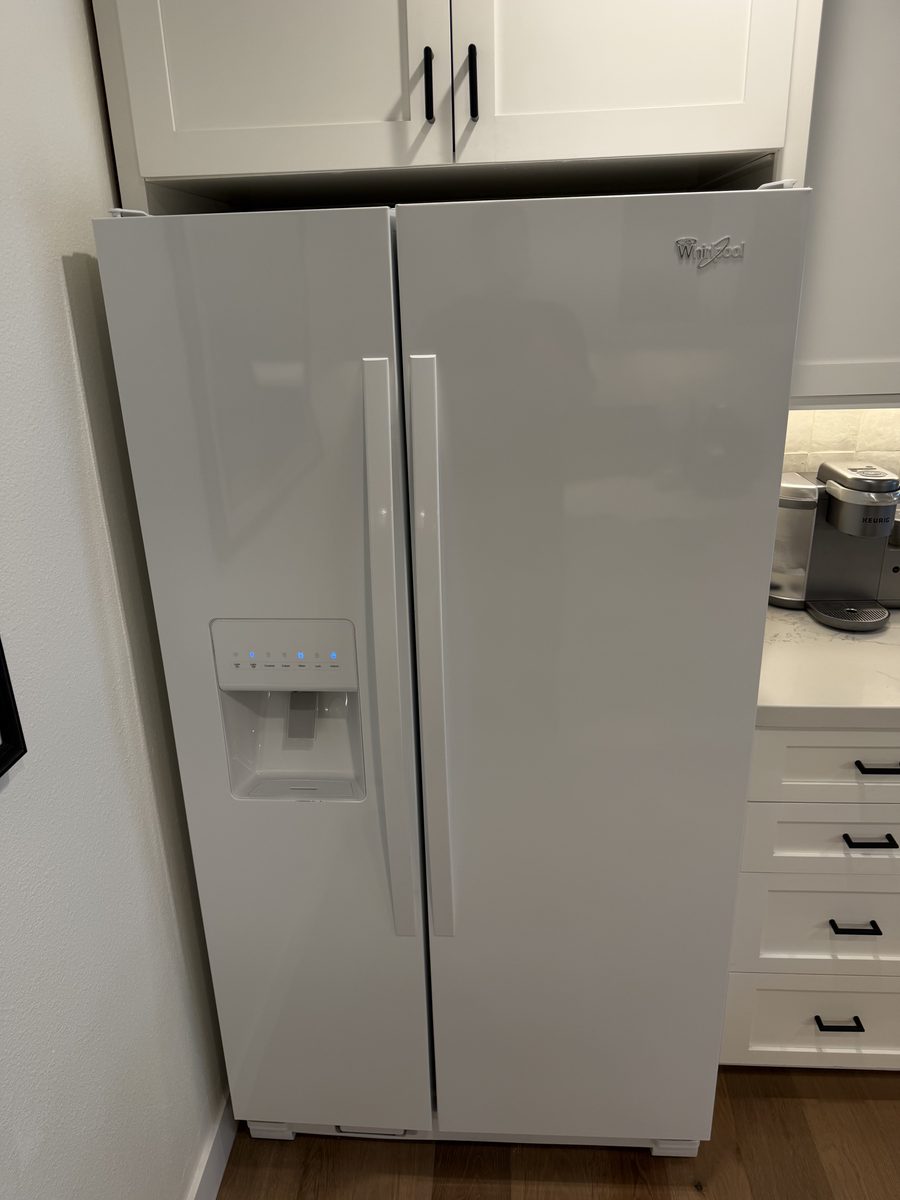 White Whirlpool side-by-side refrigerator on a Spark Appliance Repair service call in San Diego