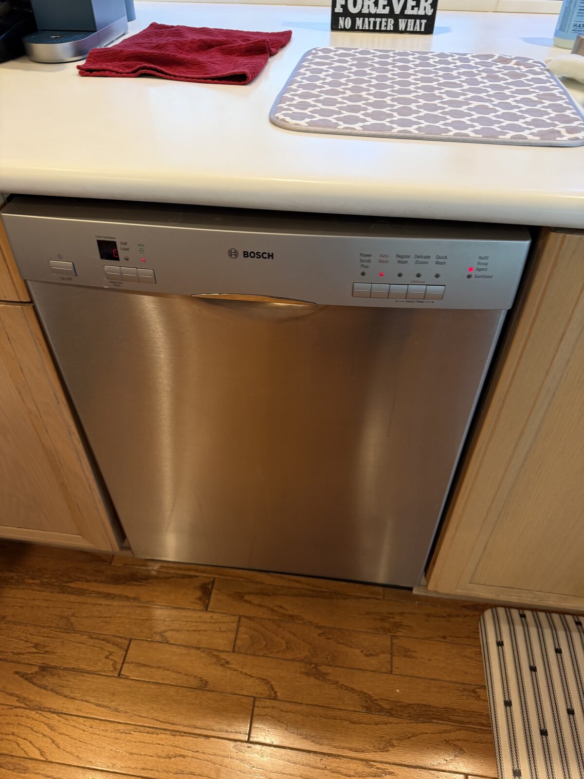 Stainless Bosch dishwasher installed under a kitchen counter on a Spark service call in San Diego