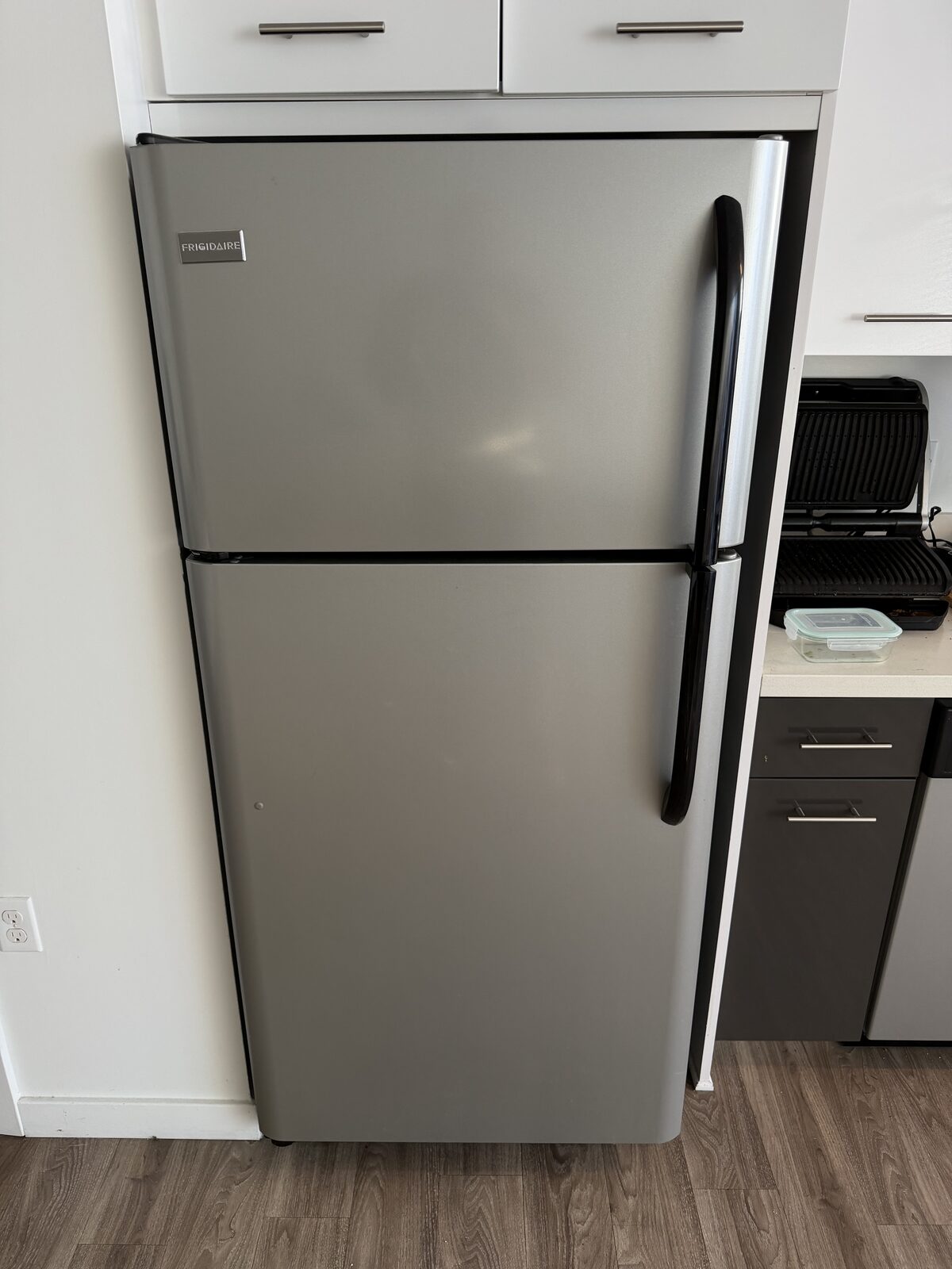 Stainless Frigidaire top-freezer refrigerator in a San Diego home during a Spark visit in June 2026