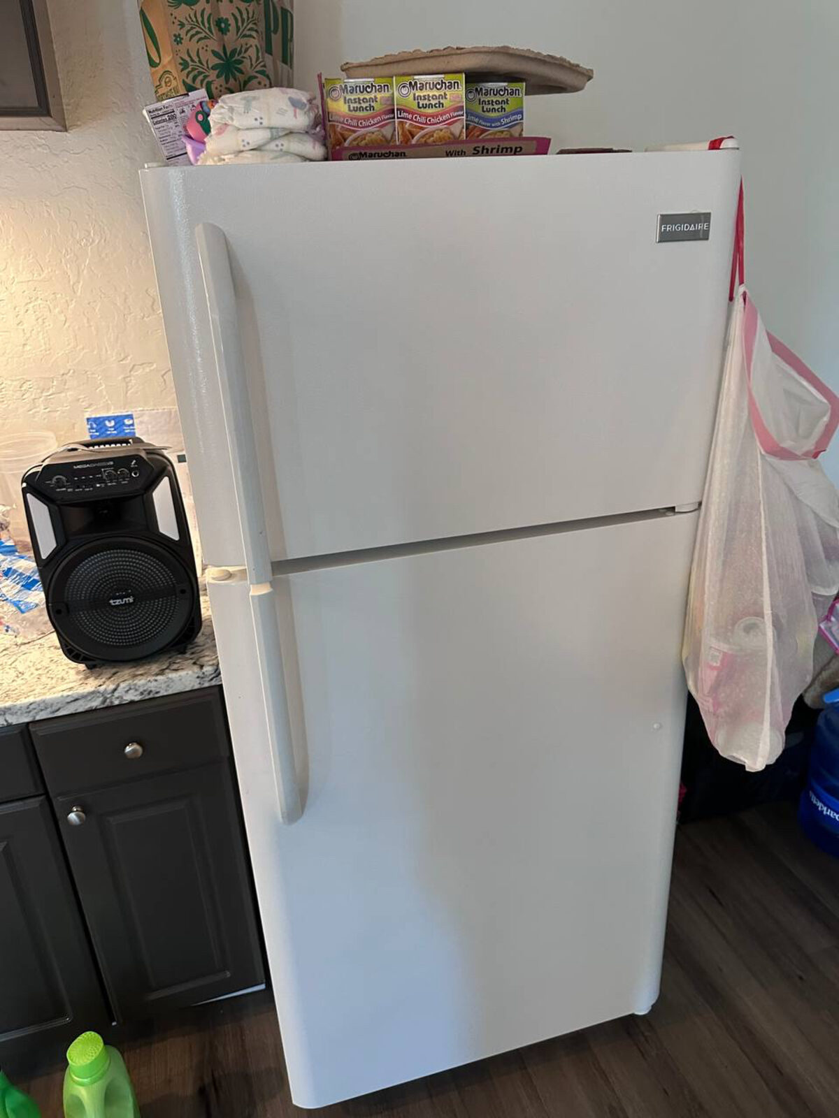 White Frigidaire top-freezer refrigerator in a San Diego County kitchen on a Spark service call