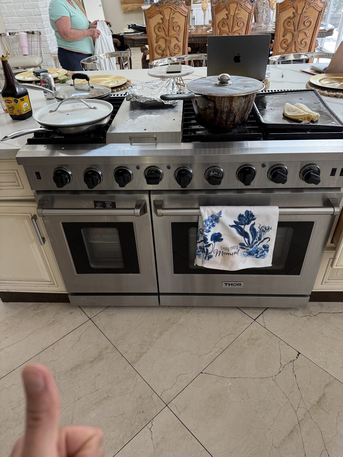 Forty-eight-inch stainless dual-oven gas range with a griddle in a kitchen island on a Spark service call