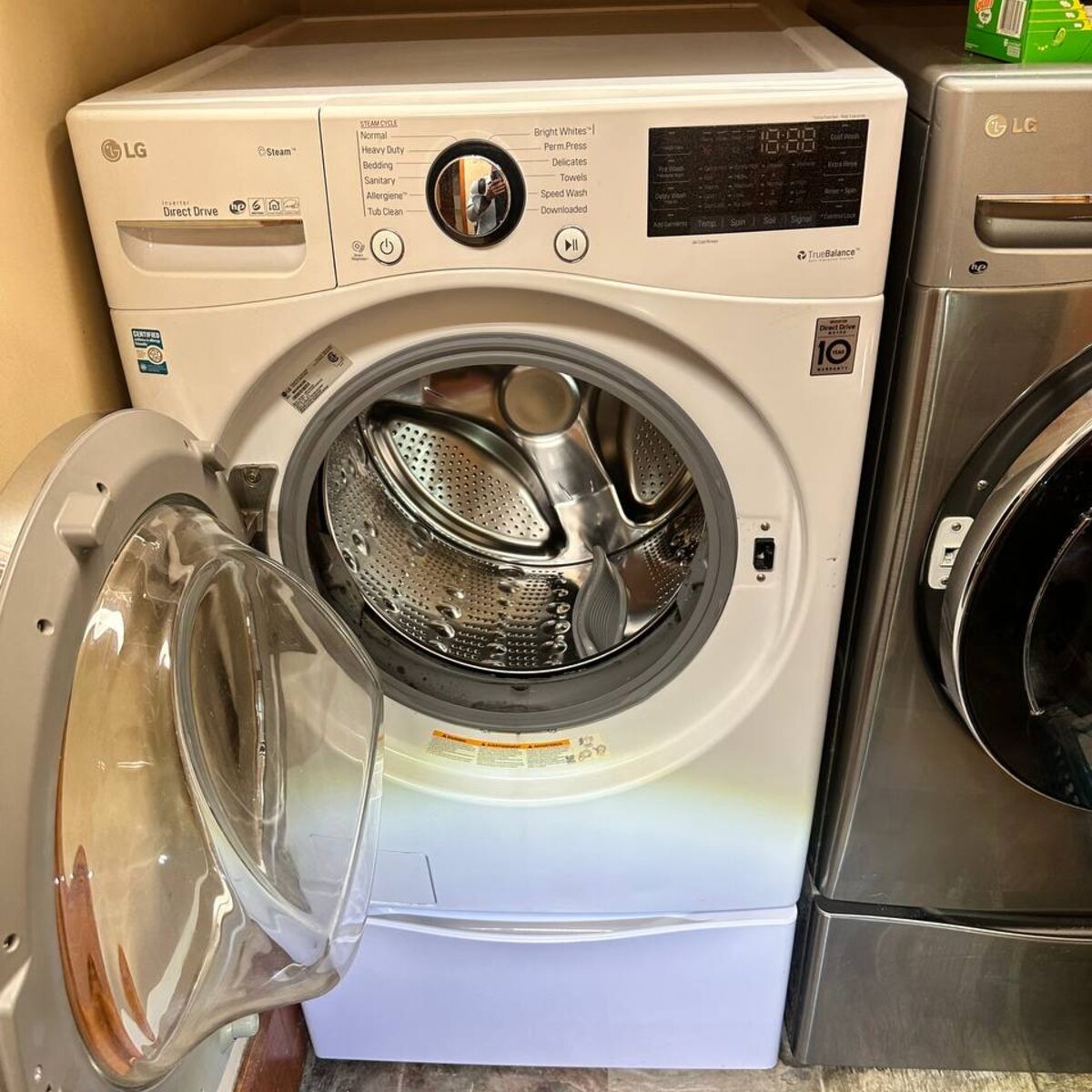 LG front-load washer with the door open on a Spark Appliance Repair service call in San Diego