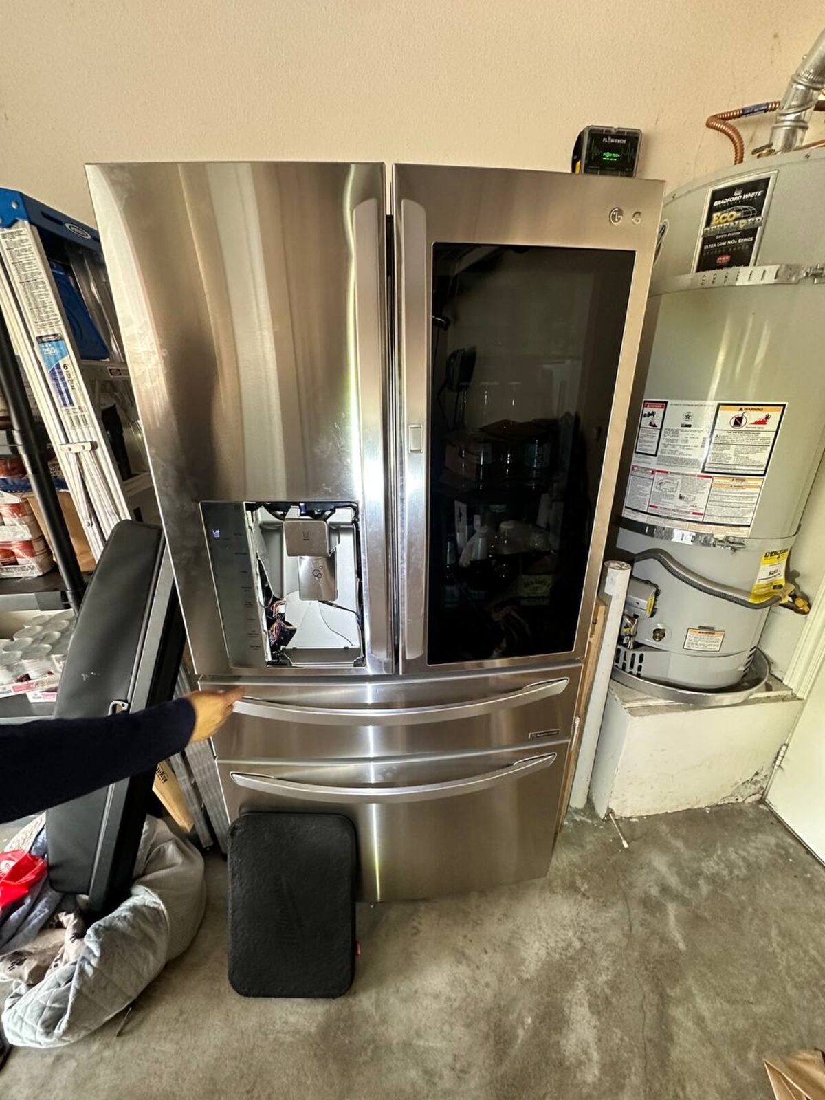 LG InstaView French-door refrigerator with the Door-in-Door panel open on a Spark service call