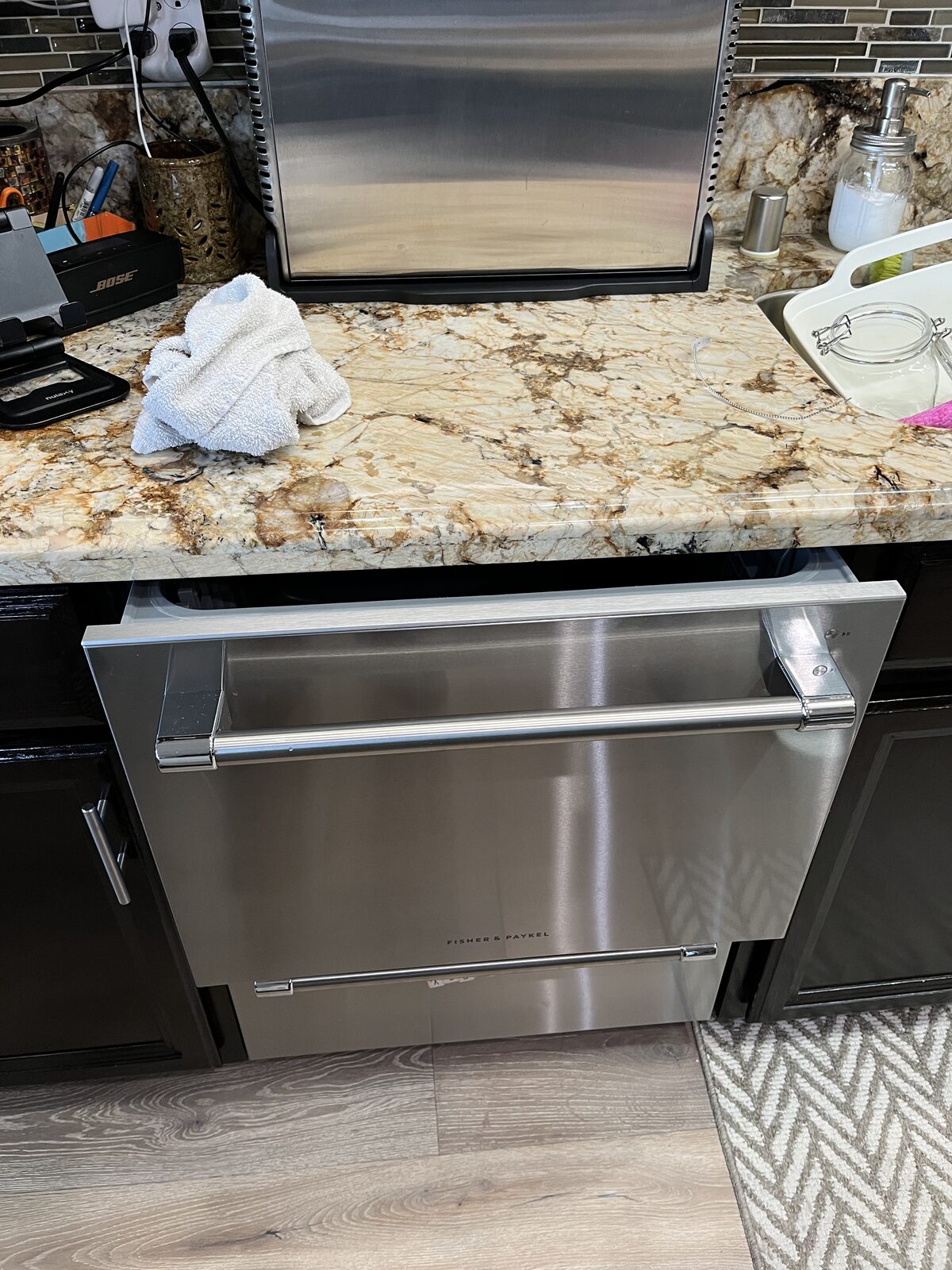 Fisher & Paykel double-drawer dishwasher under a granite counter on a Spark service call